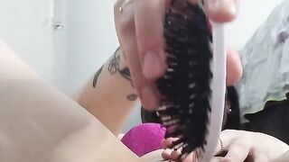 hottie sticking brush in pussy