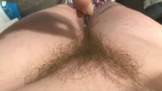 Horny housewife shows you exactly how to turn her on by running her fingers along her pubic hairs