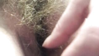 Horny housewife shows you exactly how to turn her on by running her fingers along her pubic hairs