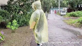 Teen in yellow raincoat flashes pussy outdoors in the rain