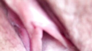 Cum flows from a meaty, swollen and fucked up pussy. Close-up. Amateur video.