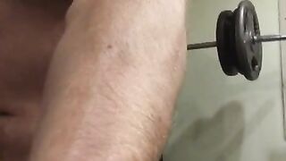 Oiled Muscular Daddy hunk with huge 7 inch cock flexes big muscles and cums after a hard workout