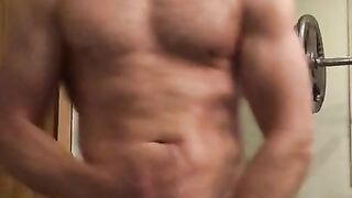 Oiled Muscular Daddy hunk with huge 7 inch cock flexes big muscles and cums after a hard workout