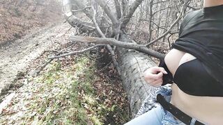 Girl masturbates in the forest near the road