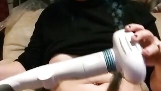 Milf plays with back massager.