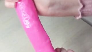 schoolgirl lubricates pink cock before sitting on it