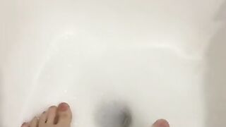 Sexy girl in the bathroom masturbating with her feet and herself