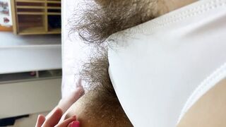 Hairy pussy in white swimsuit closeup