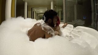 Fucking a slut at a resort in a bubble bath