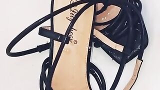 Slow motion cumshot on sexy black heels