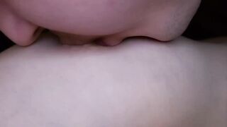 I lick my girlfriend's nipples slobberingly. She moans loudly in pleasure