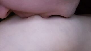 I lick my girlfriend's nipples slobberingly. She moans loudly in pleasure