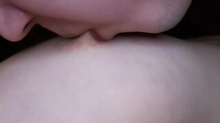 I lick my girlfriend's nipples slobberingly. She moans loudly in pleasure