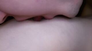 I lick my girlfriend's nipples slobberingly. She moans loudly in pleasure