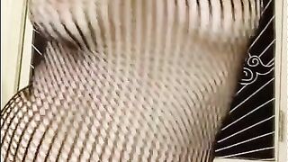 showing off my body and dancing in fishnet bodystockings