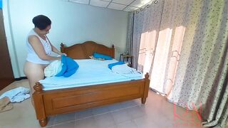 Nudist housekeeper Regina Noir makes the bedding in the bedroom. Naked maid. Naked housewife. c2