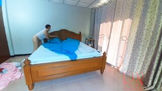 Nudist housekeeper Regina Noir makes the bedding in the bedroom. Naked maid. Naked housewife. c2