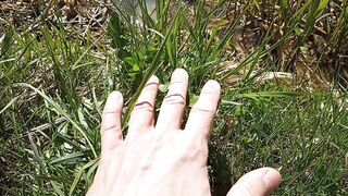 Petting grass on camera