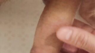 Pissing in the bathroom in my palm and jerking off my dick to the boner.