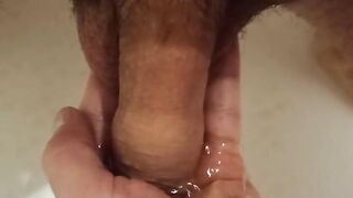 Pissing in the bathroom in my palm and jerking off my dick to the boner.