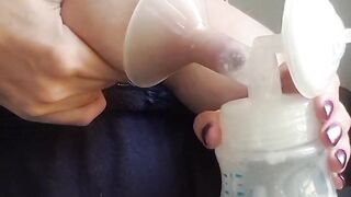 Squeezing and pumping breast.