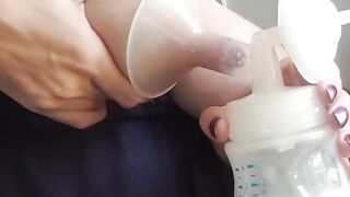 Squeezing and pumping breast.