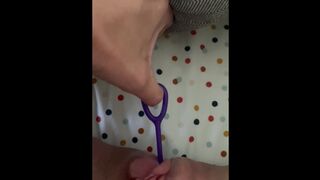 Pushing out toys from hairy pussy