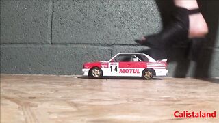 Goddess Calista sprays a miniature sports car