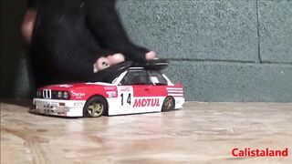 Goddess Calista sprays a miniature sports car