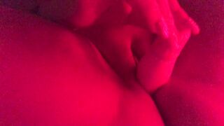 Masturbating in red mood lighting