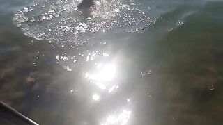 Swimming naked at the nudist beach