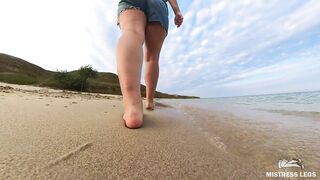 Barefoot Girl Walks Over The Summer Seashore