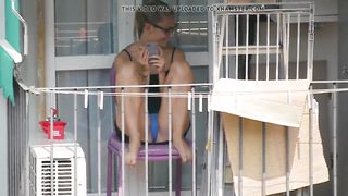 Teen neighbor shows upskirt on the balcony III