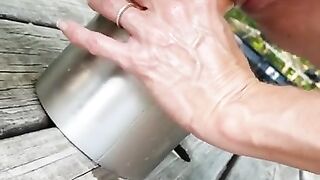 Hot horny wife makes her pussy squirt. Husband films her outside on picnic table