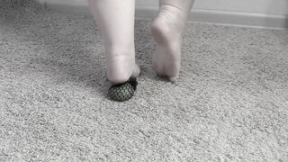 She crushed the ball with her bare feet. Tapping fetish.