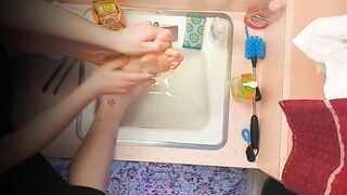 18 year old washing feet in sink