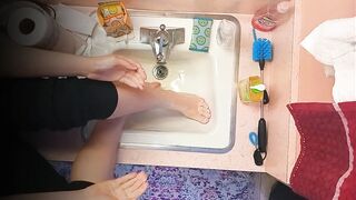 18 year old washing feet in sink