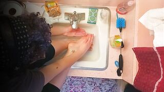 18 year old washing feet in sink