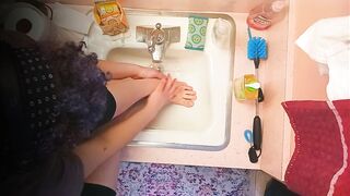 18 year old washing feet in sink