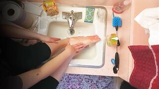 18 year old washing feet in sink