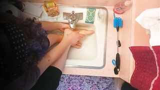 18 year old washing feet in sink