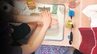 18 year old washing feet in sink