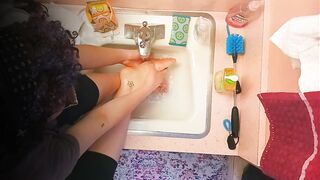 18 year old washing feet in sink