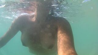 Naked, swiming at the sea