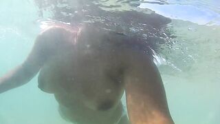 Naked, swiming at the sea