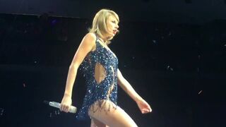 Taylor Swift performing in skimpy blue outfit