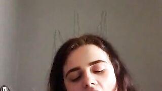 Girl making faces while I stick buttplug in her ass