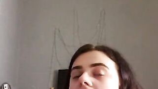 Girl making faces while I stick buttplug in her ass