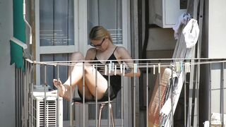 Candid Blonde Babe Showing her Feet on the Balcony