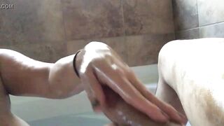 Mom gives amazing handjob to a big cock in bathtub